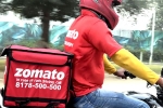 Zomato net loss, Zomato latest updates, zomato has half its net loss, Zomato